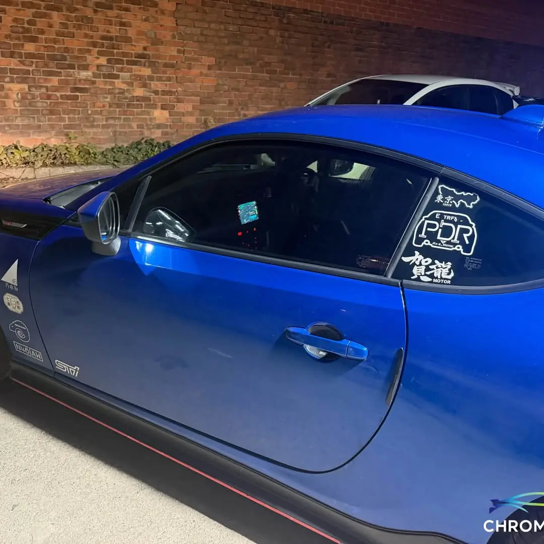 Tinted door glass on a blue Subaru BRZ
