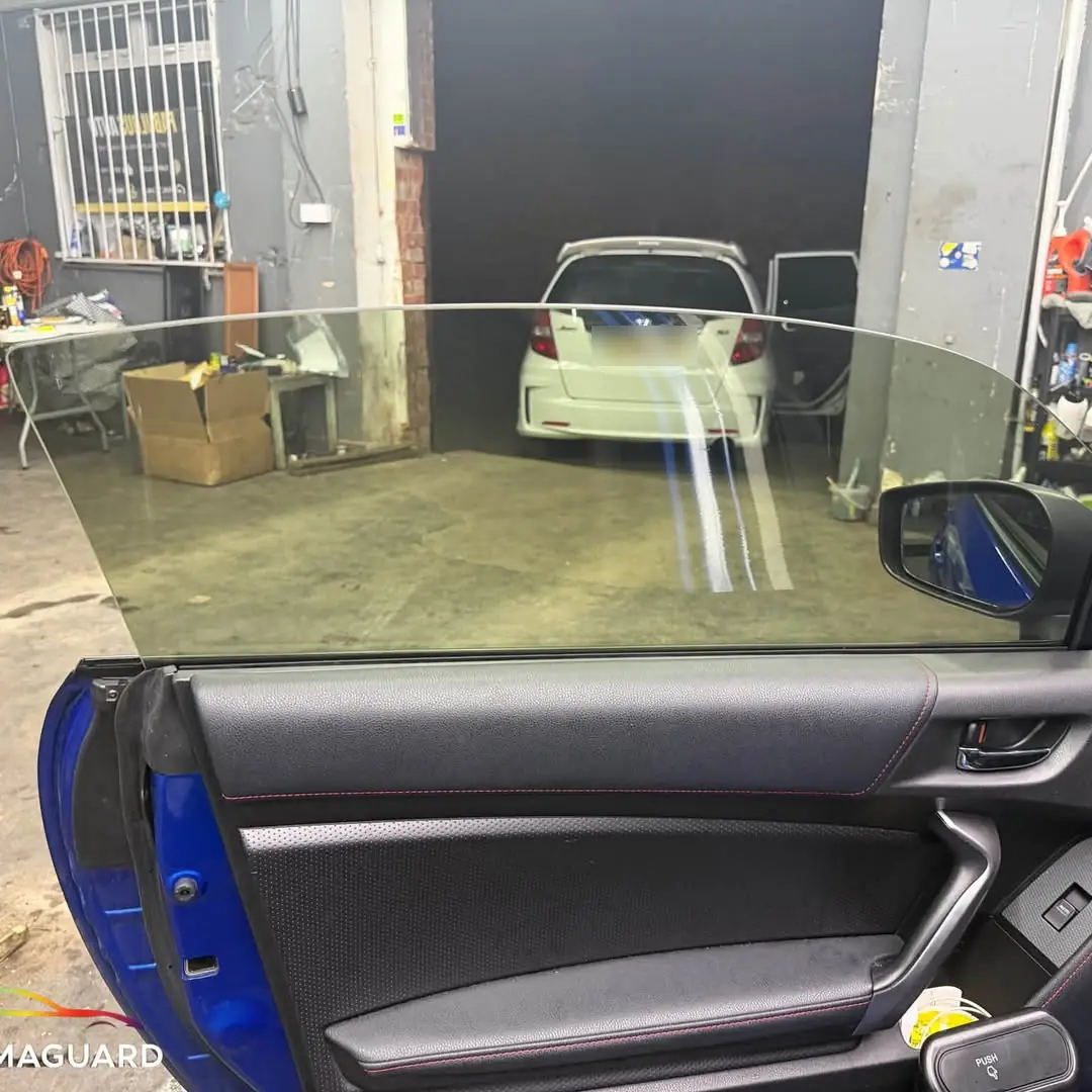 Car door with window film being fitted in the ChromaGuard studio